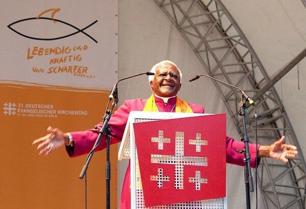 Desmond Tutu laughs at smart ID card